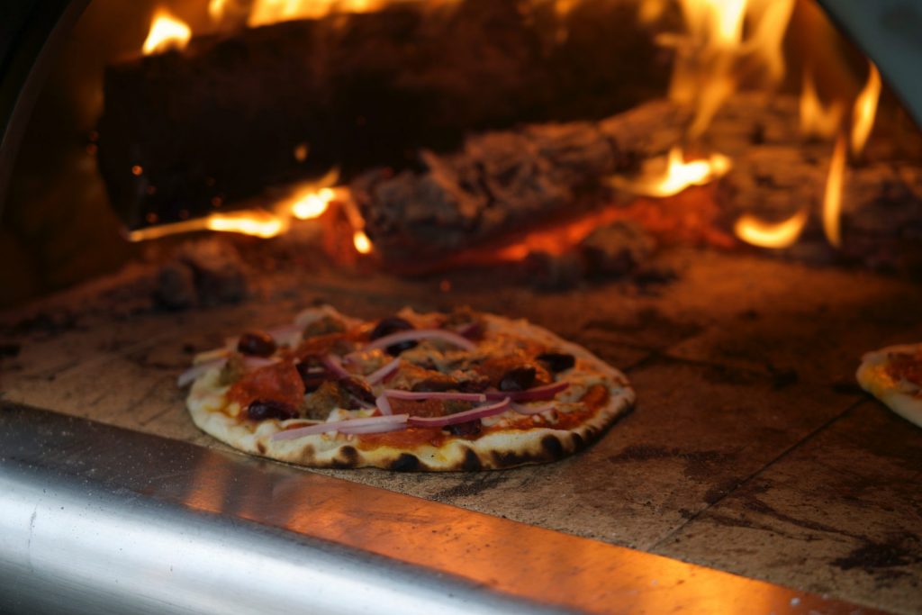 A pizza made in a traditional oven