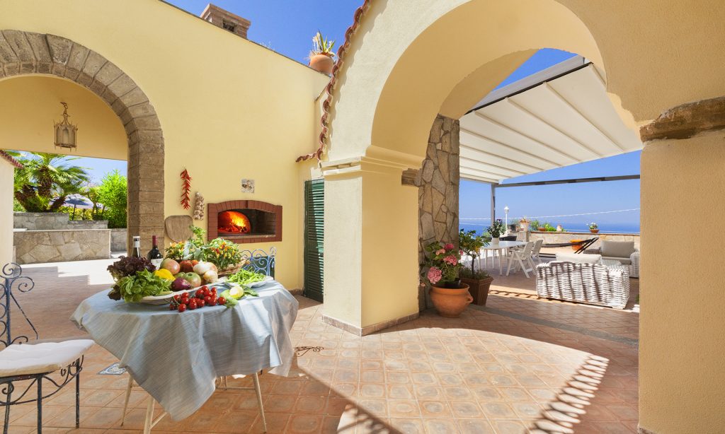 Outdoor dining at Villa Ferrara